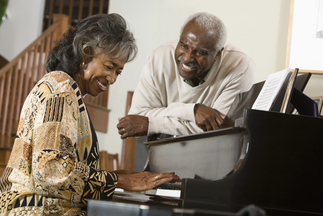 Senior African woman playing piano