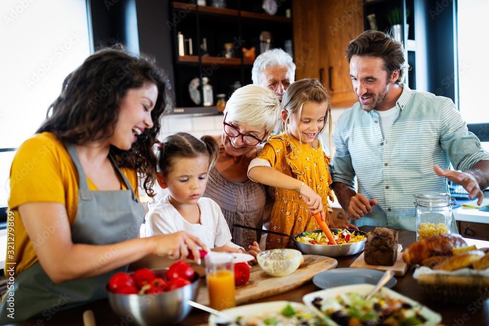A reminder about Family Health History Day from the Prevent Cancer Foundation. Image depicts family members preparing a meal while chatting amongst themselves.